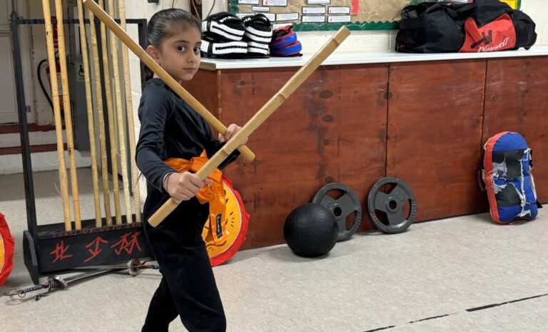 Children learning Shaolin Kung Fu techniques during kids class at Shaolin Kung Fu Gym